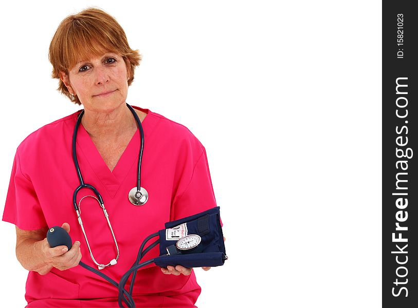 Nurse Stitting While Holding A Blood Pressure Monitor. Nurse Stitting While Holding A Blood Pressure Monitor