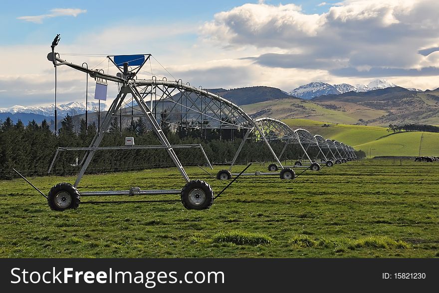 Massive pivot irrigation system on a farm in North Canterbury, New Zealand. Massive pivot irrigation system on a farm in North Canterbury, New Zealand.