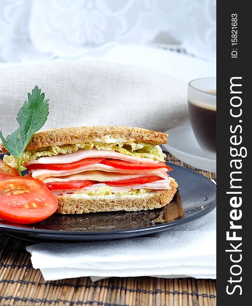 Fresh and delicious classic club sandwich over a white glass dish with coffee. Fresh and delicious classic club sandwich over a white glass dish with coffee