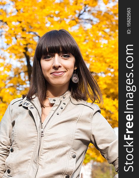 Beauty woman with yellow leaves on background. Beauty woman with yellow leaves on background