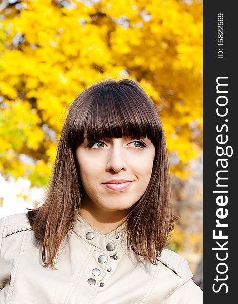 Beauty woman with yellow leaves on background. Beauty woman with yellow leaves on background