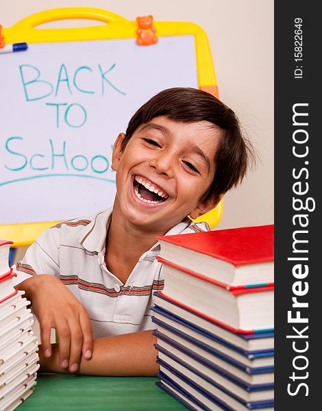 Smiling boy with school books