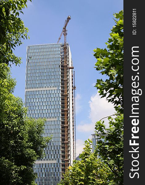 A modern tower toward the end of construction. A modern tower toward the end of construction