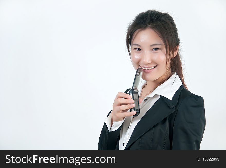 A Smiling business girl  with a cell phone