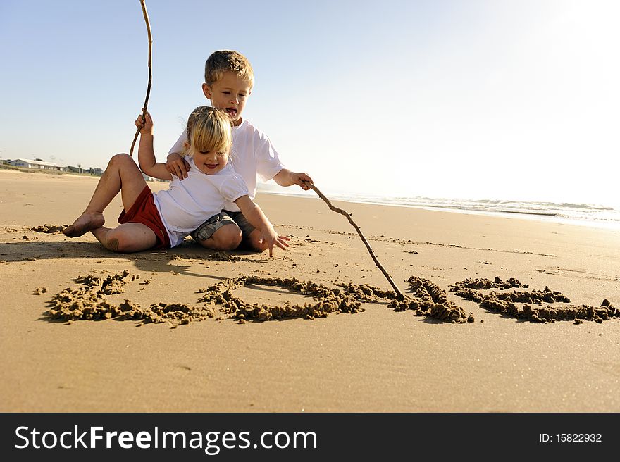 Kids Writing In Sand