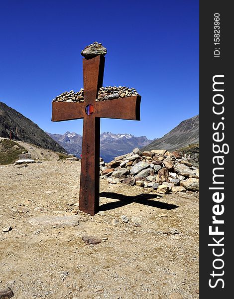 Senior cross on the mountain in the saddle in the Tyrolean Alps Timmelsjoch. Senior cross on the mountain in the saddle in the Tyrolean Alps Timmelsjoch