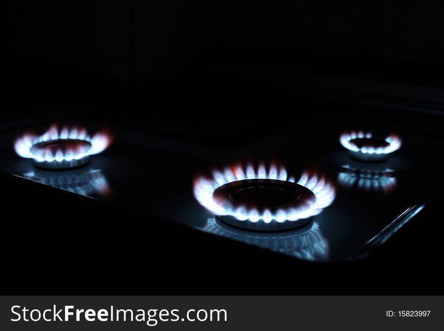 Close up of kitchen gas range with burning. Close up of kitchen gas range with burning..