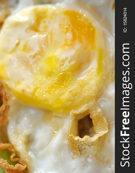 Macro close up of fried egg. For concepts such as diet and nutrition, and food and beverage. Macro close up of fried egg. For concepts such as diet and nutrition, and food and beverage.