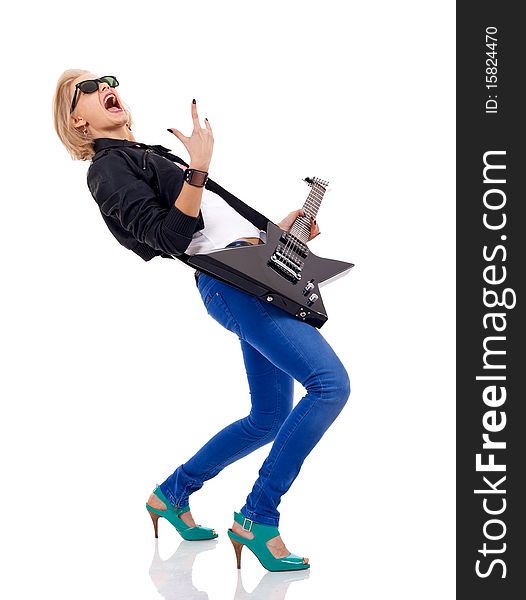 Picture of an energic blond girl wearing glasses and playing a guitar and making a rock and roll gesture. Picture of an energic blond girl wearing glasses and playing a guitar and making a rock and roll gesture