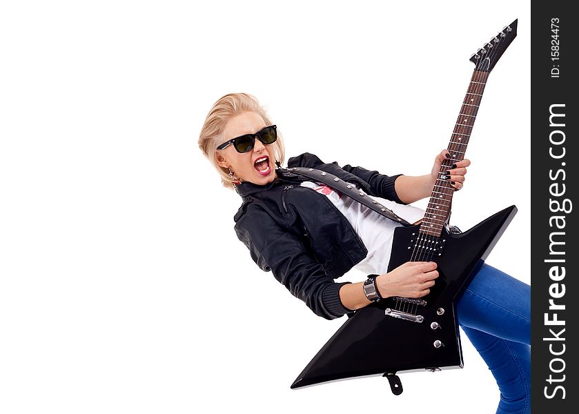 Rock star girl with sunglasses playing an electric guitar