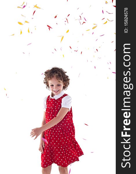 Little blond girl throwing flower petals over white background