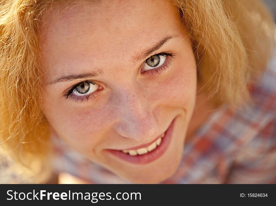 Close-up portrait of beautiful blonde girl. Focus on eyes.