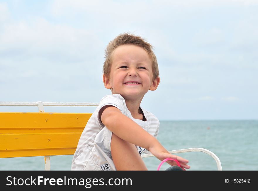 Little cute boy on the beach