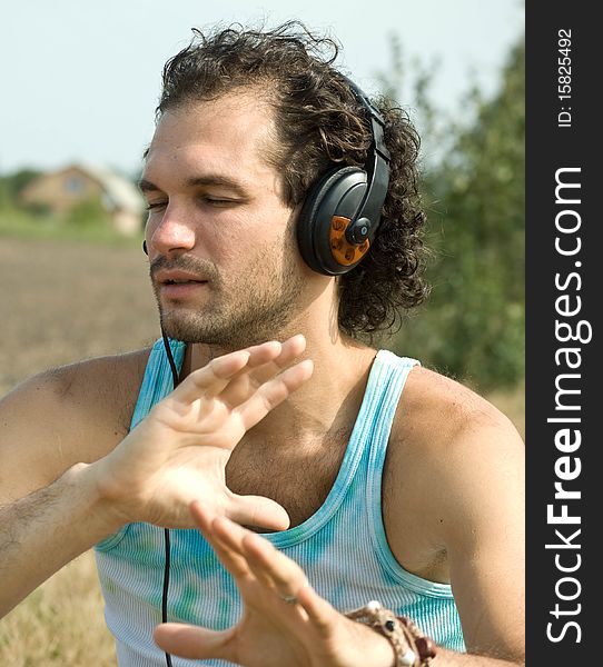 Young man with headphones outdoor
