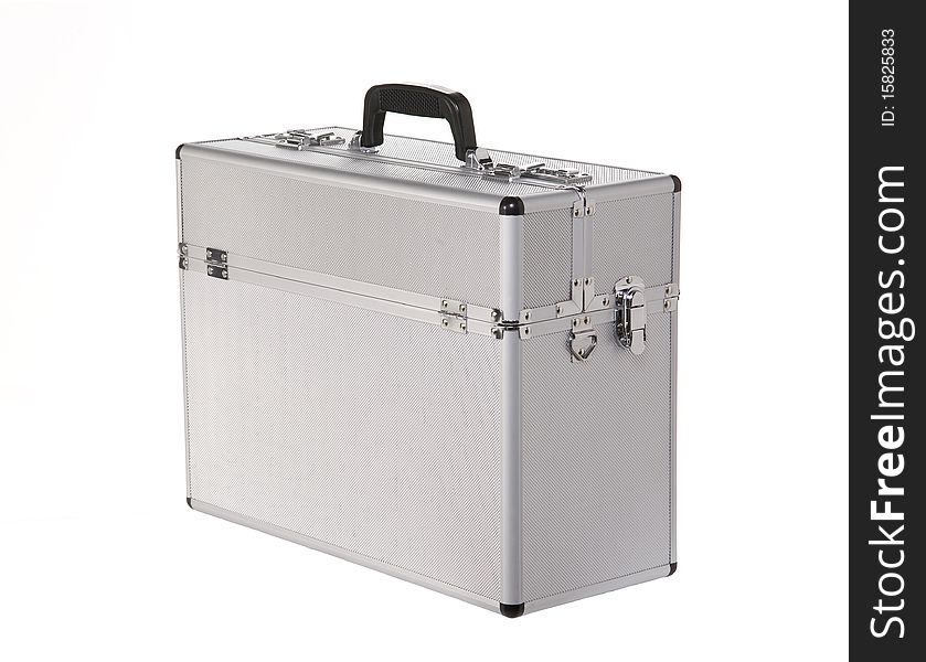 Aluminum suitcase shot in the studio. The suitcase is isolated in front of white background. Aluminum suitcase shot in the studio. The suitcase is isolated in front of white background.