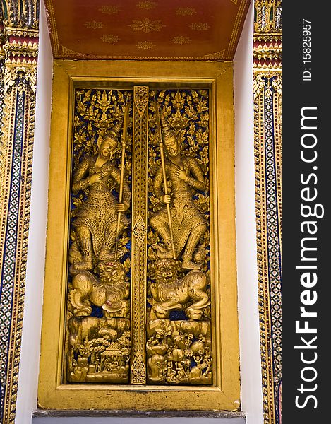 Story on the golden door at Wat Phra Kaeo. Story on the golden door at Wat Phra Kaeo