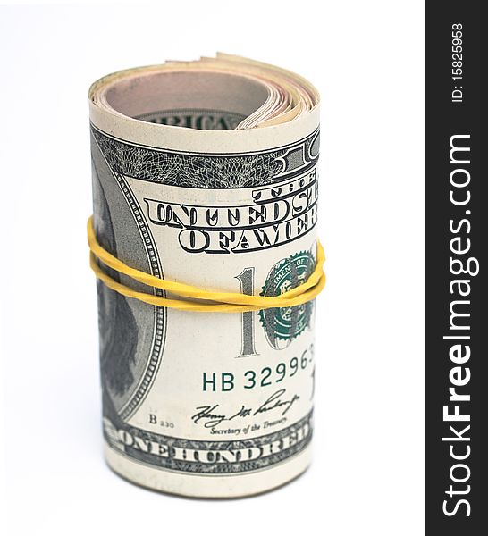 Bundle of dollar bills folded in a roll isolated on white. Bundle of dollar bills folded in a roll isolated on white