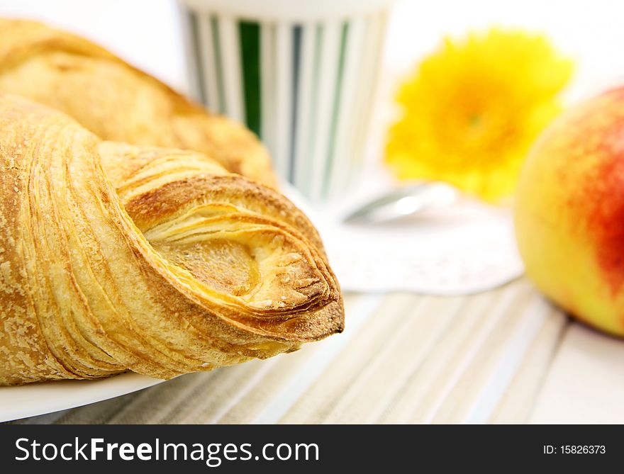 Fresh croissant closeup on breakfast table