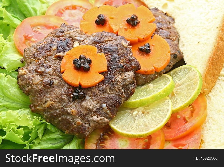 Grill Beef Hamburger with vegetable and bread, closeup