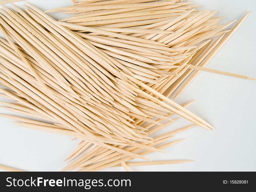 Photo of a hip of toothpicks, spillaged on the table.