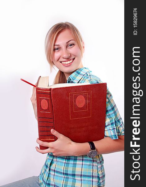 Studying happy young woman reading her book for school. Studying happy young woman reading her book for school