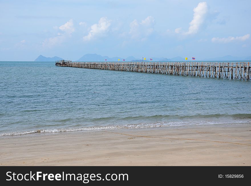 Long Wooden Pier Into The Sea