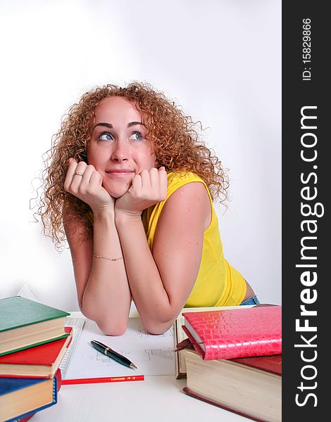 Studying happy young woman reading her book for school. Studying happy young woman reading her book for school