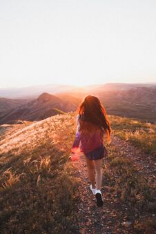 Happy Young Woman Running In Sunset Light. Freedom Concept Royalty Free Stock Photography
