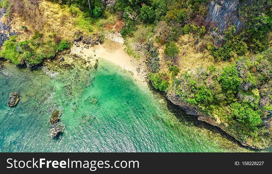 Aerial drone view of tropical Ko Phi Phi island, beaches and boats in blue clear Andaman sea water from above