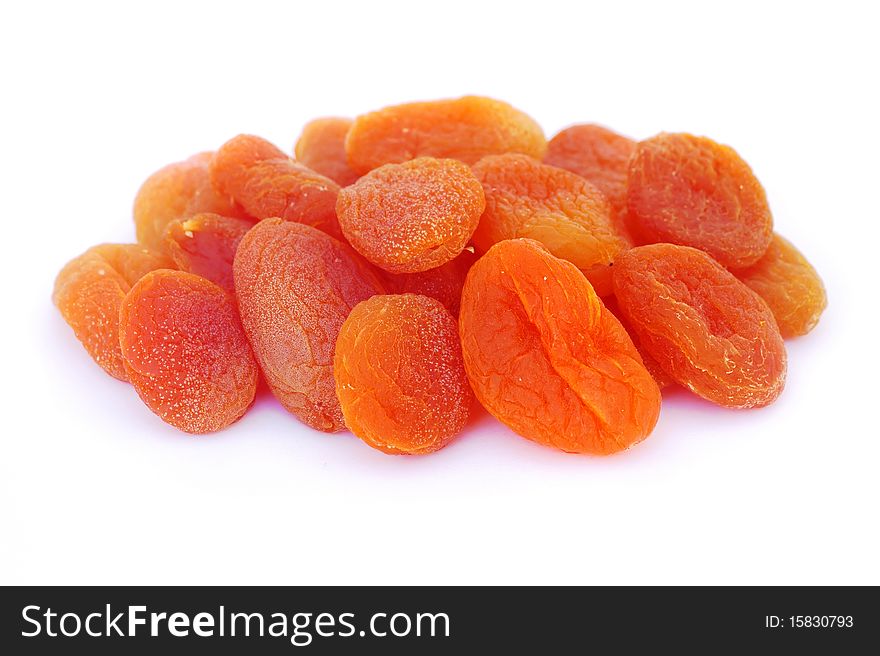 Close-up shot of dried apricots, isolated on white background