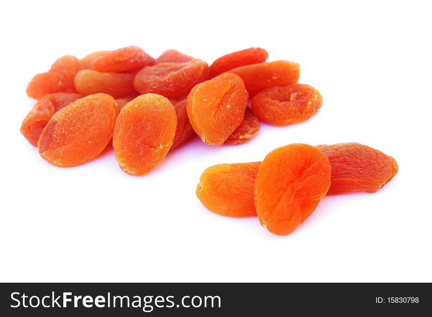 Close-up shot of dried apricots, isolated on white background