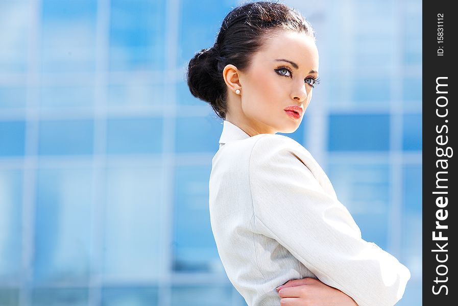 Beautiful business woman at modern building