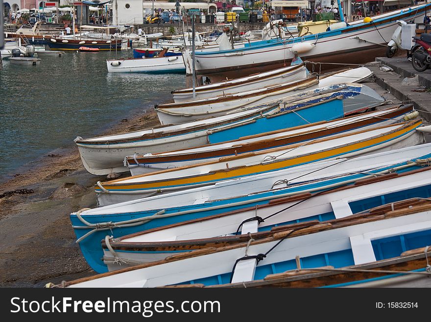 Wooden rowing boats beached in Capri harbour. Wooden rowing boats beached in Capri harbour