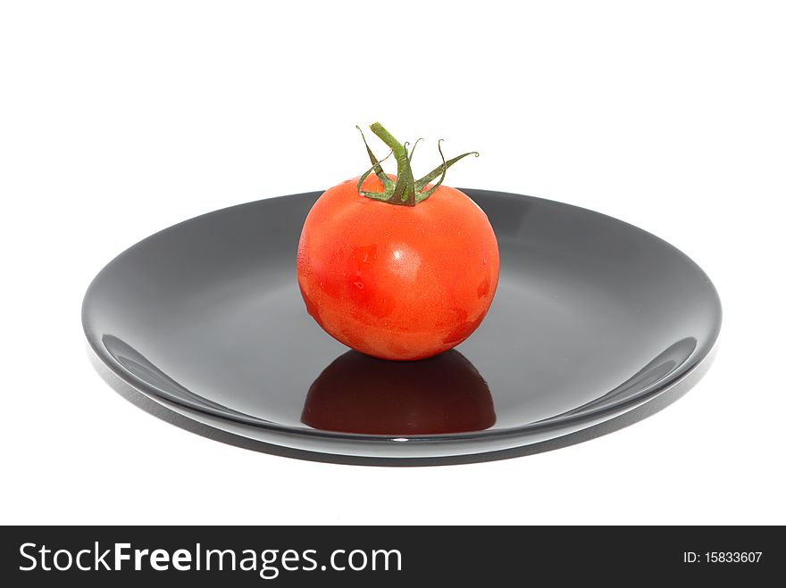 Red tomato on the white background. Red tomato on the white background