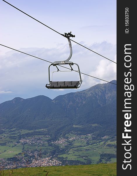 Chair-lift In The Italian Alps On A Cloudy Day
