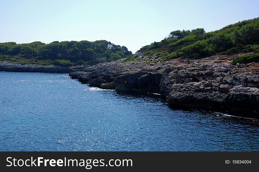 View of an idilic beach and coast in southeast of Mallorca (Spain). View of an idilic beach and coast in southeast of Mallorca (Spain)