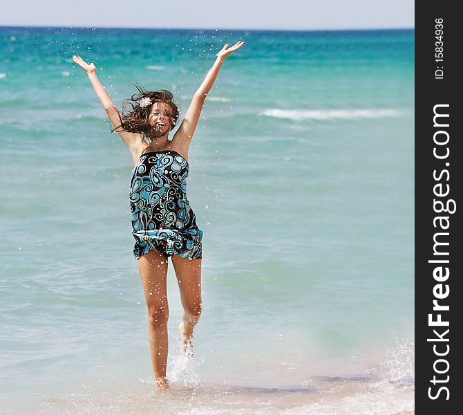 Happy young girl in water drops. Happy young girl in water drops