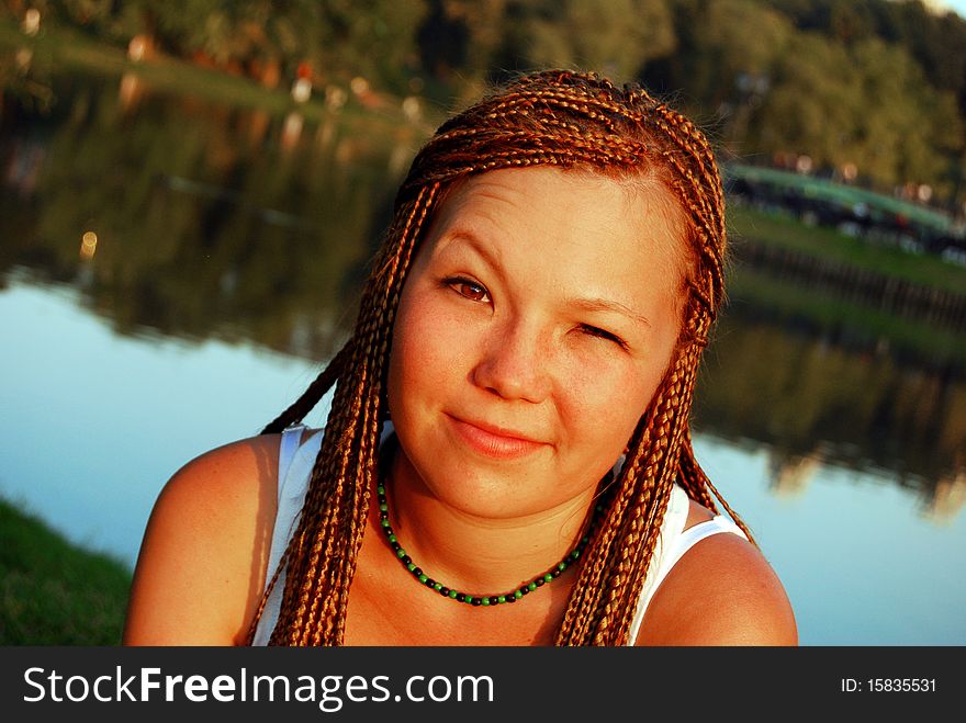 Pretty asian girl with braids looks skeptically. Pretty asian girl with braids looks skeptically