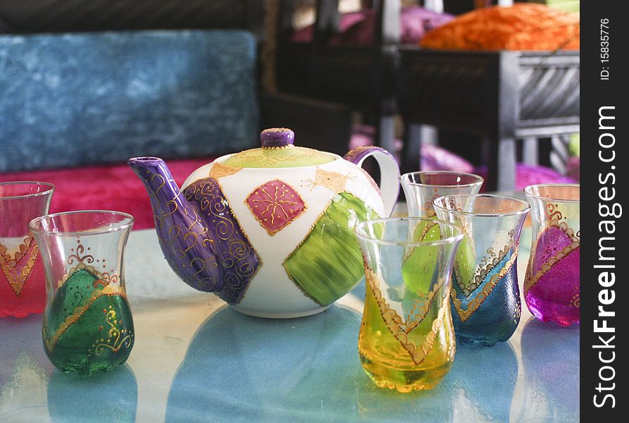 Moroccan teapot and some painted cups. Moroccan teapot and some painted cups