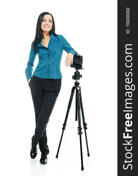 Portrait of beauty brunette with tripod and camera on white. Portrait of beauty brunette with tripod and camera on white