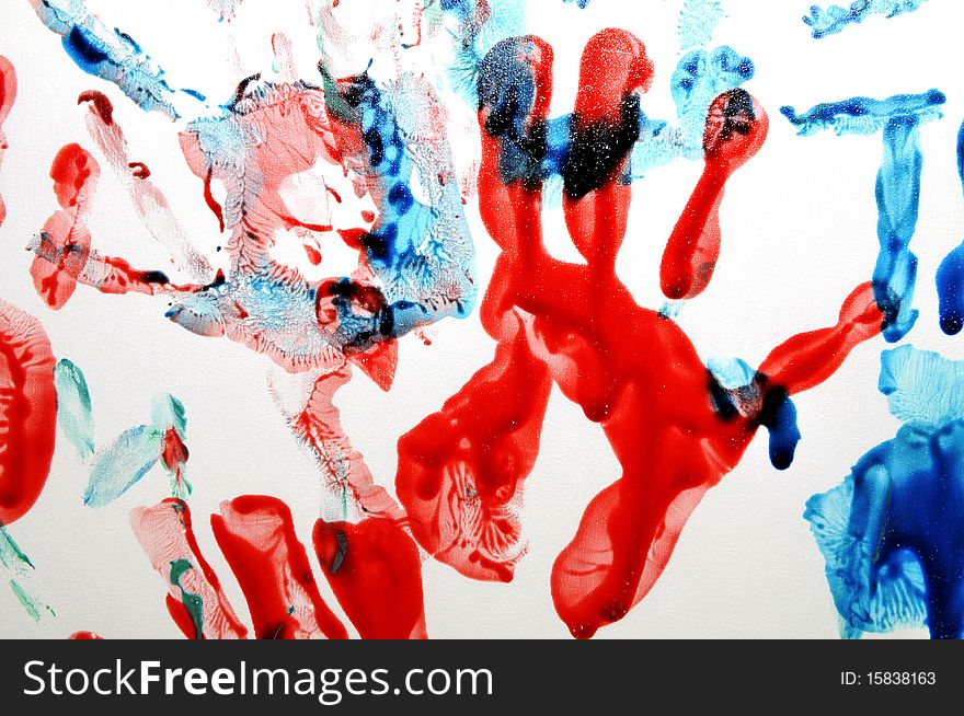 Colorful hand prints on white background