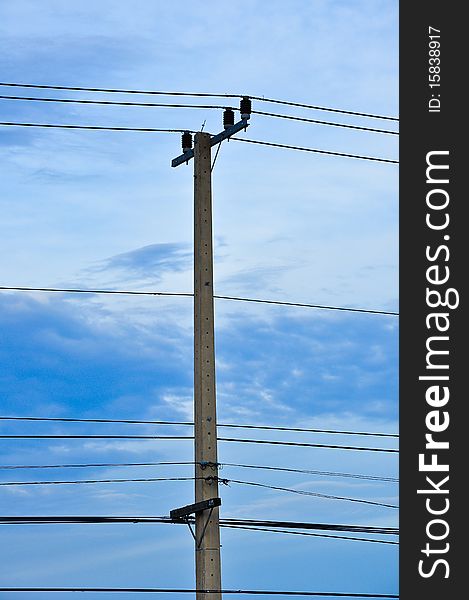 Electricity post standing by highway , Thailand