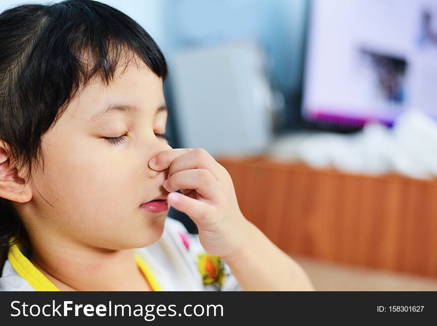 Asian Little Girl Sick With Hand Holding The Nose Get Cold And Blow Nose The Flu Season - Child Runny Nose And Sneezing Blowing