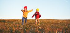 Happy Kids Boy And Girl Running And Laughing On Autumn Nature Walk Royalty Free Stock Photo Happy Kids Boy And Girl Running And Laughing On Autumn Nature Walk Royalty Free Stock Photo