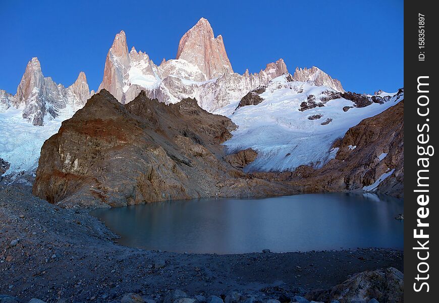 Fantastic Fitz Roy mountain in Patagonia and reflection in lake. Argentina. Fantastic Fitz Roy mountain in Patagonia and reflection in lake. Argentina