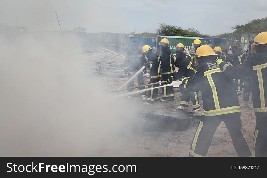 Somali firemen demonstrate their newly learned skills during an excercise attended by the Mayor of Mogadishu, Mohamed Nur, and AMISOM&#x27;s Contingent Commander, Brigadier General Michael Ondoga, in Mogadishu on July 6. AU UN IST PHOTO / ABDI IYE. Somali firemen demonstrate their newly learned skills during an excercise attended by the Mayor of Mogadishu, Mohamed Nur, and AMISOM&#x27;s Contingent Commander, Brigadier General Michael Ondoga, in Mogadishu on July 6. AU UN IST PHOTO / ABDI IYE