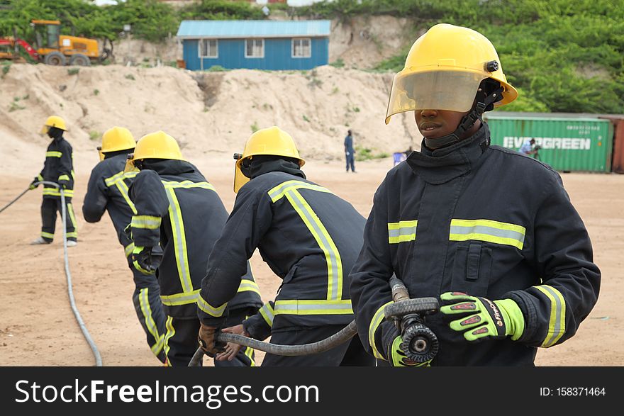 Somali firemen demonstrate their newly learned skills during an excercise attended by the Mayor of Mogadishu, Mohamed Nur, and AMISOM&#x27;s Contingent Commander, Brigadier General Michael Ondoga, in Mogadishu on July 6. AU UN IST PHOTO / ABDI IYE. Somali firemen demonstrate their newly learned skills during an excercise attended by the Mayor of Mogadishu, Mohamed Nur, and AMISOM&#x27;s Contingent Commander, Brigadier General Michael Ondoga, in Mogadishu on July 6. AU UN IST PHOTO / ABDI IYE