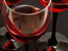 Two Glasses Of Red Wine Close-up Over Red Backgrou Stock Images Two Glasses Of Red Wine Close-up Over Red Backgrou Stock Images