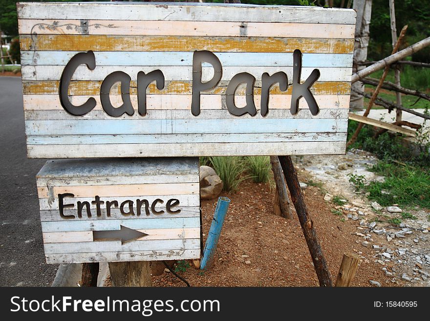 Wood sign car park entrance