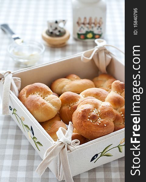 Tied Buns  Over Bread Plate With Butter